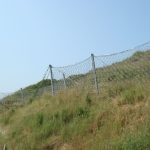 DEBRIS FLOW BARRIER AT DISCOVERY BAY NORTH DEVELOPMENT: TOWN PLAZA