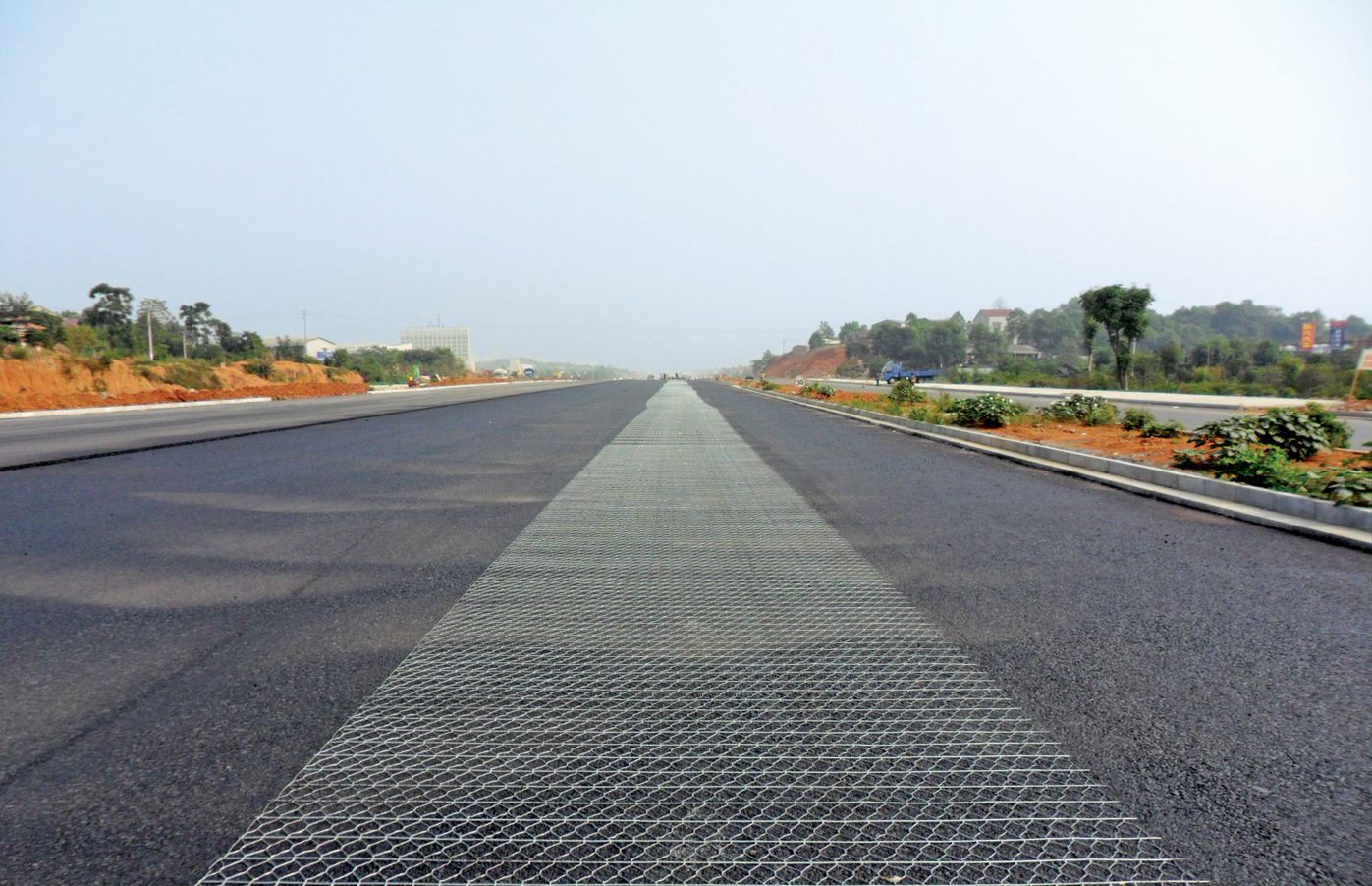 Asphalt road reinforcement